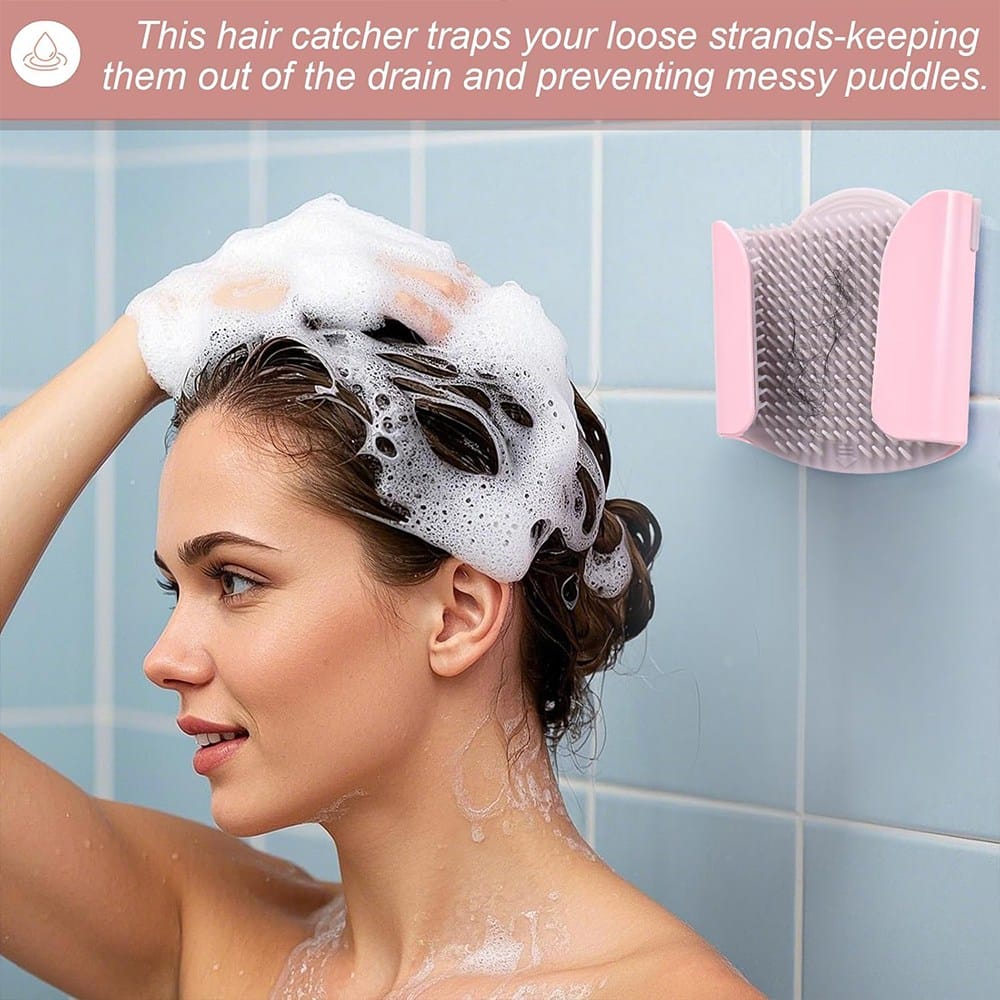 Person using fingers to trap loose hair in the bristles of a shower hair catcher
